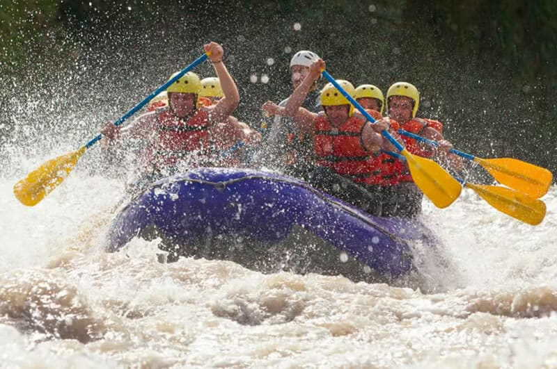 photo of whitewater rafting team in control