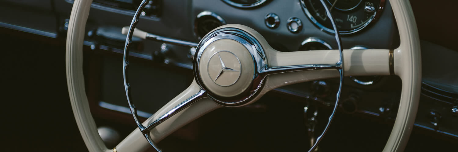 Unsplash.com photo by Clem Onojeghuo - driving your brand with emotional intelligence - steering wheel of a classic Mercedes Benz