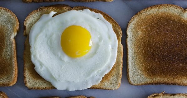 Culture eats strategy for breakfast - how to build a culture of trust. Photo of egg on toast by Leti Kugler on Unsplash