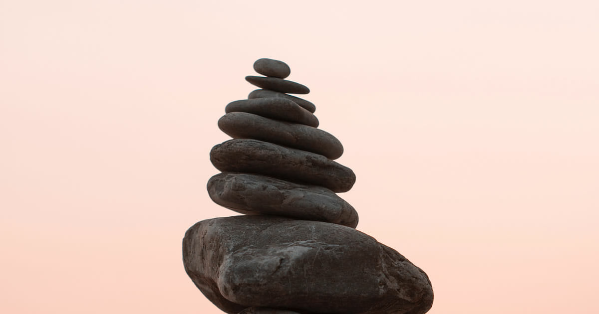 Photo of rocks balanced in a stack by Bekir Dönmez on Unsplash