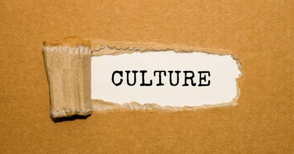 Make culture count - The text Culture appearing behind torn brown paper