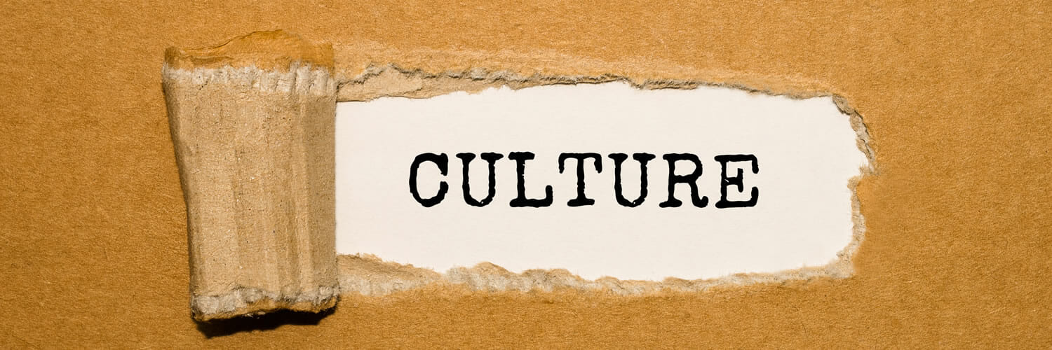 Make culture count - The text Culture appearing behind torn brown paper