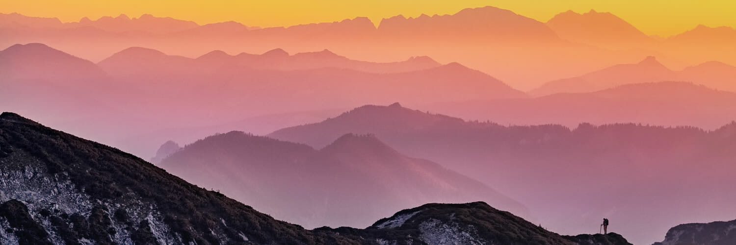 Contributing as a Multiplier - hiker on mountaintop - Photo by Simon Matzinger on Unsplash