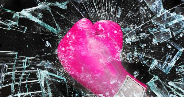 Breaking Bias - imnage of pink boxer's glove smashing glass