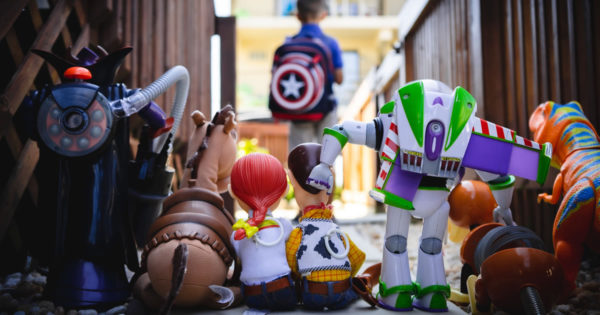 Photo of Toy Story action figures watching a boy go back to school by Chris Hardy on Unsplash