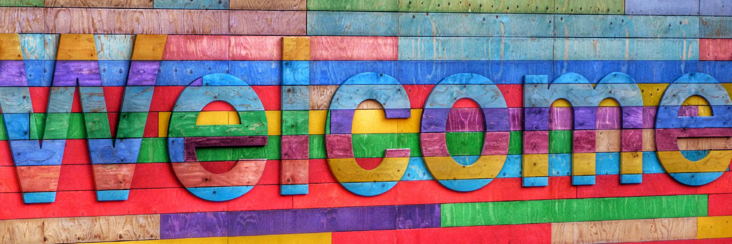 Colorful welcome sign - Photo by Belinda Fewings on Unsplash