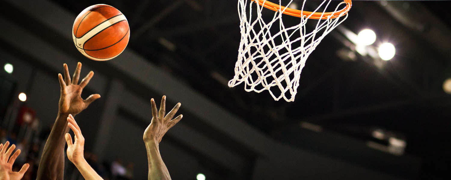 Advantage Performance CEO Jon Hodge talks with John Beilein,one of the USA's standout career basketball coaches, on how to build a high-performance team. (basketball action shot of hands and hoop)