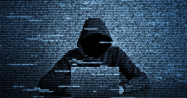 Decision-making traps: How cyber criminals exploit the way we make decisions (concept image of a hacker at a laptop )