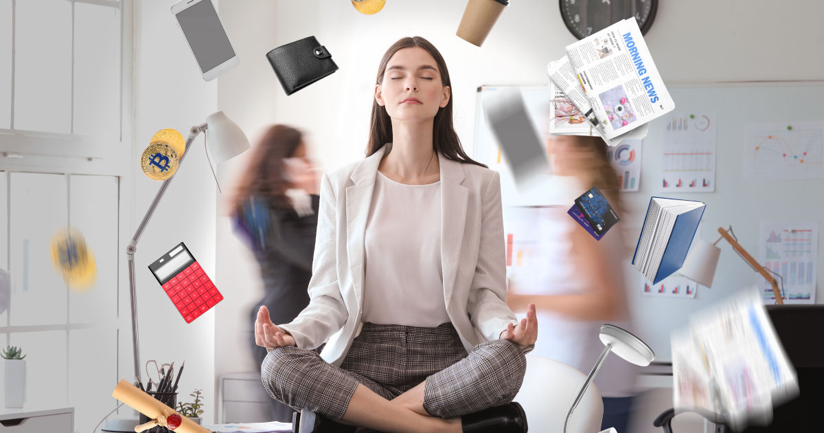 Well-Being in the Workplace through Emotional Intelligence (Different things flying around young businesswoman meditating in office.)