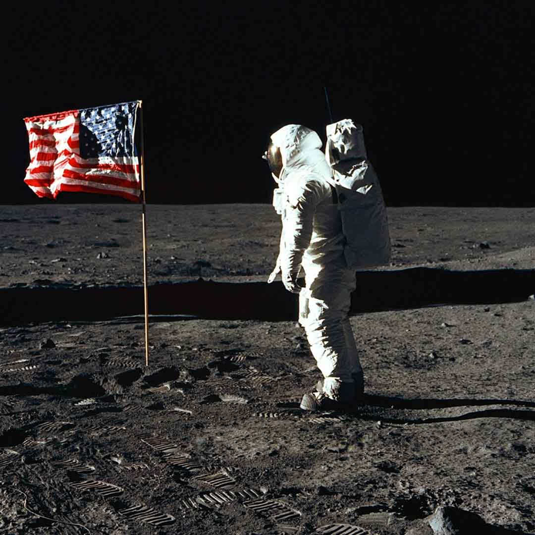 Astronaut Buzz Aldrin, lunar module pilot of the first lunar landing mission, poses for a photograph beside the deployed United States flag during an Apollo 11 Extravehicular Activity on the lunar surface (photo by NASA on Unsplash)