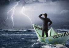 Is your leadership ready for the storm? (business man in a paper boat on stormy seas)