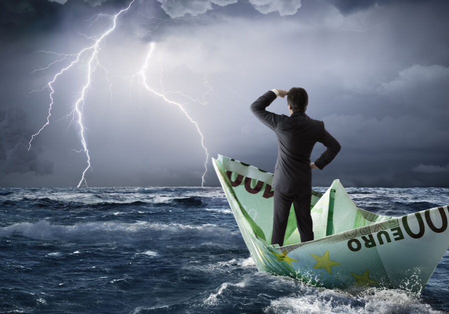 Is your leadership ready for the storm? (business man in a paper boat on stormy seas)