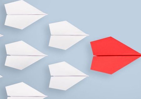 Are you an effective influencer? Ask these 5 questions to see how you stack up. (Origami paper planes in formation with red leader)